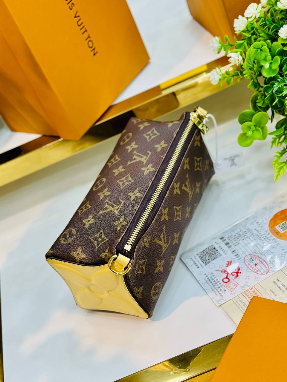Trousse à main Louis Vuitton Bloom Monogram