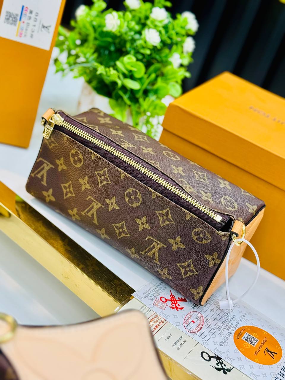 Trousse à main Louis Vuitton Bloom Monogram
